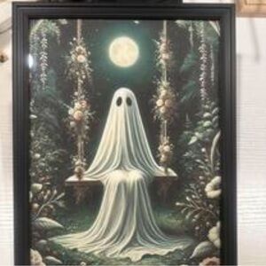 Spooky ghost on a swing with flowers, featuring a beautiful white green design